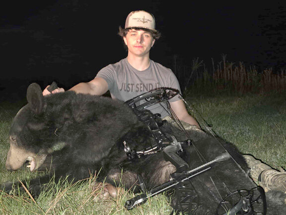 Trestyn Smith and the bear he harvested Sept. 2025