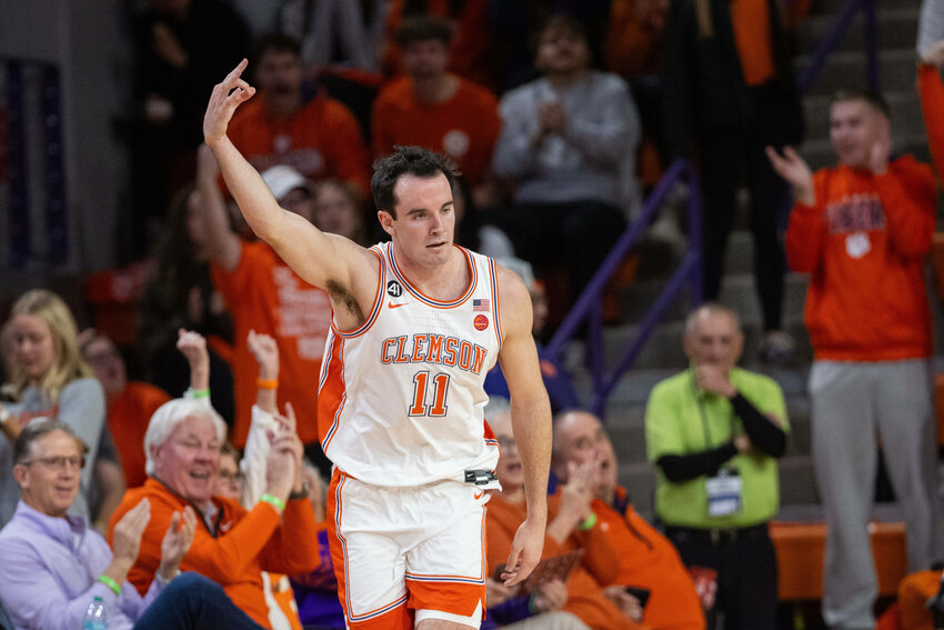 Clemson forward Nick Davidson (11) celebrates a three against the Boston College on Tuesday, Jan. 13, in Clemson.