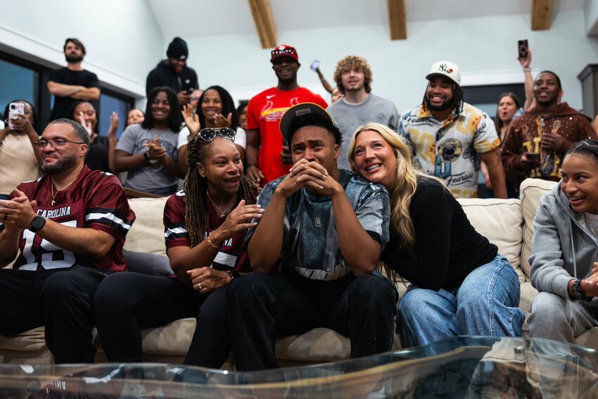 Former Lakewood and South Carolina standout Brandon Cisse, center, is surrounded by friends and family after being selected No. 52 overall by the Green Bay Packers.