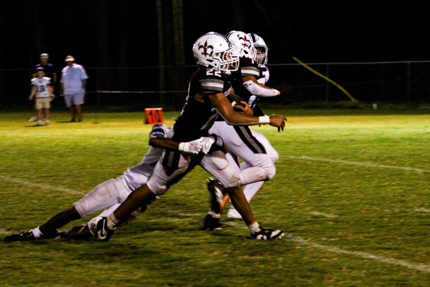 Clarendon Hall's Andrew Pritcher (22) carries the ball against Beaufort Academy on Friday.