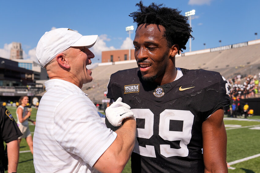 Vanderbilt head coach Clark Lea celebrates the team's win with defensive end Miles Capers (29), the former Sumter High standout, after beating North Carolina State on Saturday, Sept. 19, 2026, in Nashville, Tennessee.