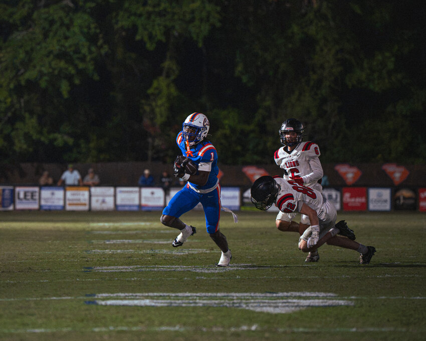 Laurence Manning's Scoop Dennis, seen against Northside Christian, scored the Swampcats' lone touchdown in their win over Porter-Gaud on Friday.