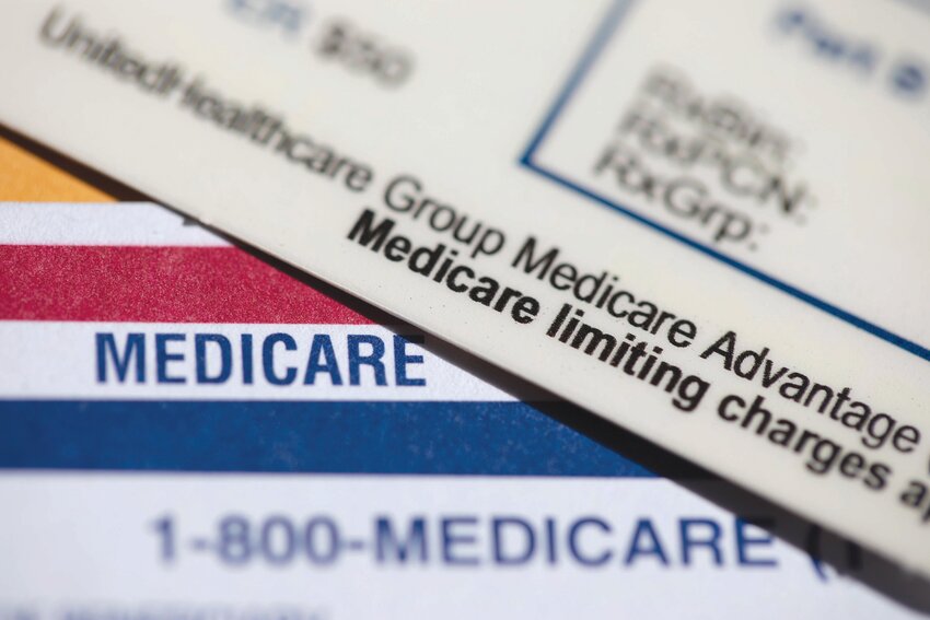 A UnitedHealthcare Group Medicare Advantage PPO card rests on top of a Medicare card is seen in Portland, Ore., June 10, 2024.