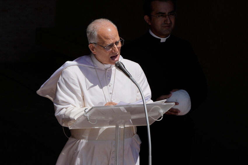 Pope Leo XIV blesses the faithful gathered in the square in front of the Apostolic Palace for the noon Angelus prayer in Castel Gandolfo, Italy, Sunday, July 20, 2025.
