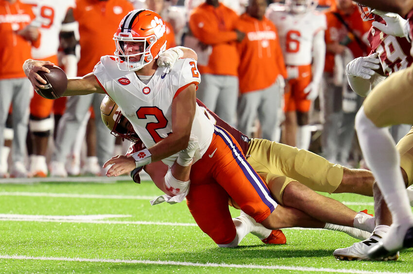 Clemson quarterback Cade Klubnik (2) reaches out for a first down during the first half against Boston College on Saturday, Oct. 11, in Boston.