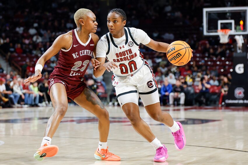 South Carolina guard Ta'Niya Latson (00) drives against North Carolina Central guard Najah Lane in Columbia on Sunday, Dec. 7, 2025.