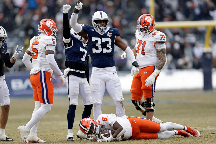 Penn State defensive end Dani Dennis-Sutton (33) reacts after tackling Clemson running back Adam Randall (8) during the Pinstripe Bowl  at Yankee Stadium on Dec. 27 in New York.