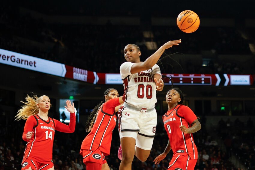 South Carolina guard Ta'Niya Latson (00) passes the ball ahead of Georgia guard Rylie Theuerkauf (14), forward Zhen Craft, second from left, and guard Trinity Turner (0) on Sunday, Jan. 11, in Columbia.
