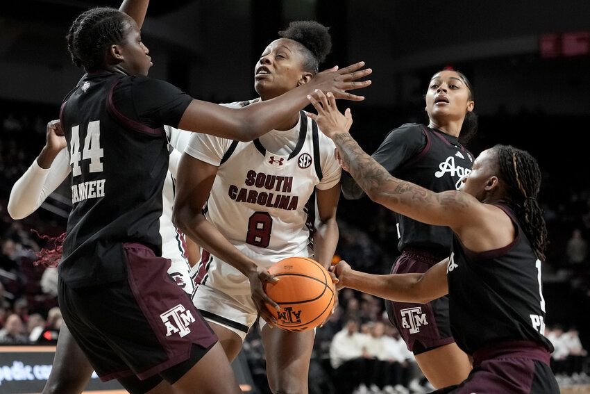 South Carolina forward Joyce Edwards (8) looks to shoot as Texas A&amp;M forward Fatmata Janneh (44) and guard Ny'ceara Pryor (1) defend on Monday, Feb. 2, 2026, in College Station, Texas.