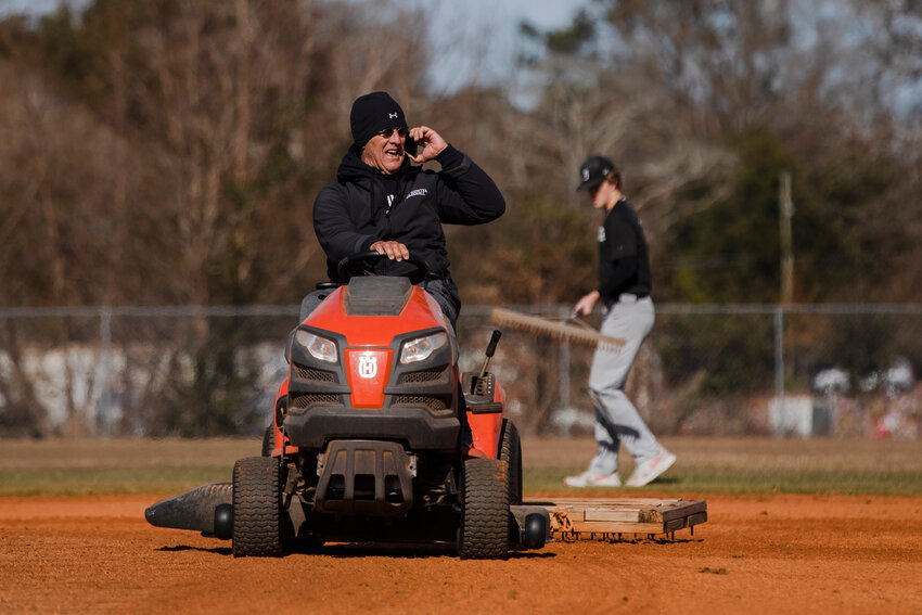 Former USC Sumter head baseball coach Tim Medlin, seen dragging the infield ahead of practice in 2021, and his wife Claudia will be recognized at a Fire Ant baseball game on Feb. 21.
