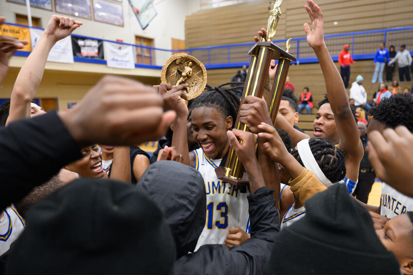 Sumter High's BJ Brown (13), seen celebrating the Gamecocks' win over Westwood on Friday, Feb. 13, was named to the SCBCA All-State team on Friday.