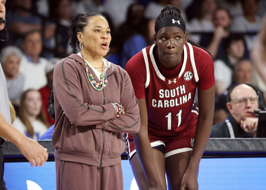 South Carolina's Madina Okot (11) has a word with head coach Dawn Staley during their matchup with Kentucky in Lexington, Kentucky, on Sunday, March 1.