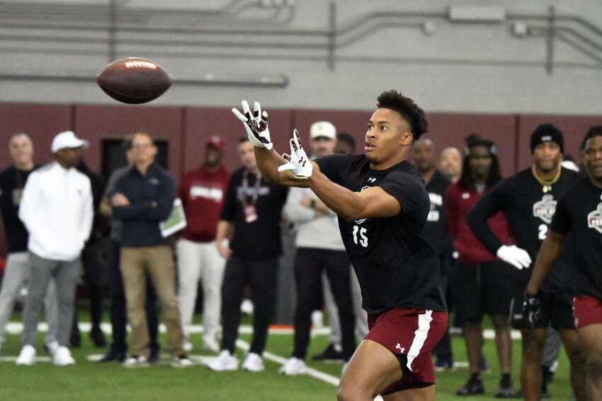 PHOTOS BY TIM LEIBLE / THE SUMTER ITEM  Former Lakewood and South Carolina defensive back Brandon Cisse catches a pass during the Gamecocks' pro day on Tuesday.