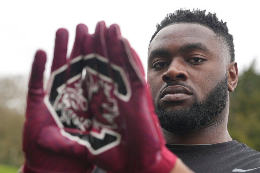Oluwanifemi 'Neff' Giwa wears South Carolina Gamecocks gloves as he takes part in a football workout session at the National Sports Center, Crystal Palace in London on Sunday, March 29, 2026.