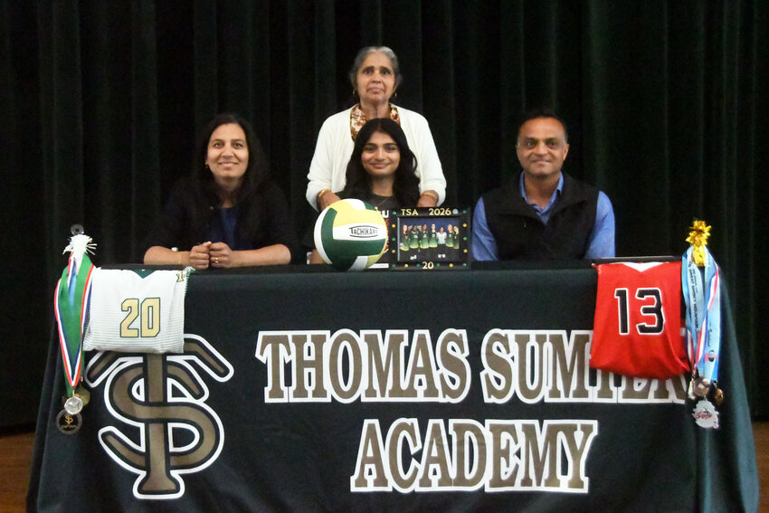 Thomas Sumter's Omnaa Patel, center, is surrounded by family after signing to continue her volleyball career at USC Sumter on Monday.
