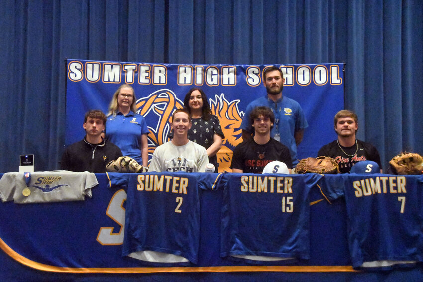 Seated from left, Sumter High's Jordan Hewett, Marion Davis, Gavin Rivers and Joseph Chapman pose as they sign to continue their athletic careers in college. They're joined by, back row from left, SHS swim coach Cathy Kirkhart, Principal Anamaria Sandor and baseball coach Will McMillan.