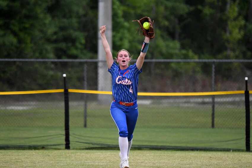 Laurence Manning's Marlee Black raises her hands in celebration after catching the final out that sent the Lady Swampcats back to the SCISA 4A state championship series on Saturday.