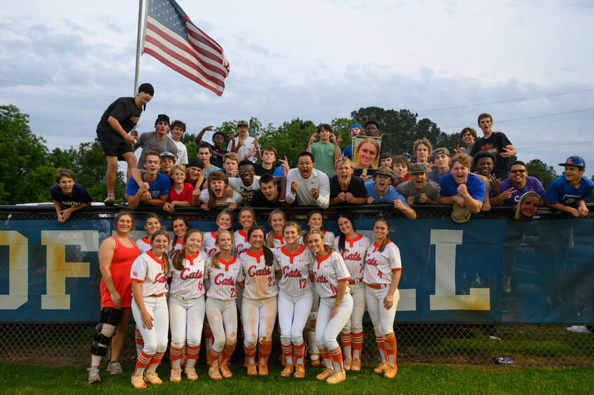 The Laurence Manning softball team poses with their student section in the outfield after winning Game 1 of the SCISA 4A championship series against Pinewood Prep on Monday.