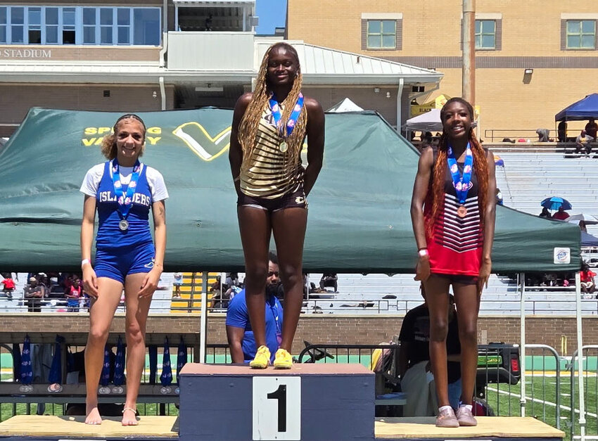 Lee Central's Serenity Williams, center, stands atop the podium after winning the 400m dash at the SCHSL 1A state championships on Saturday at Spring Valley.