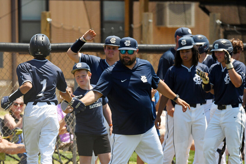 Curtis Johnson, center, is leaving East Clarendon after four years and returning to Sumter High as the school's athletic director.