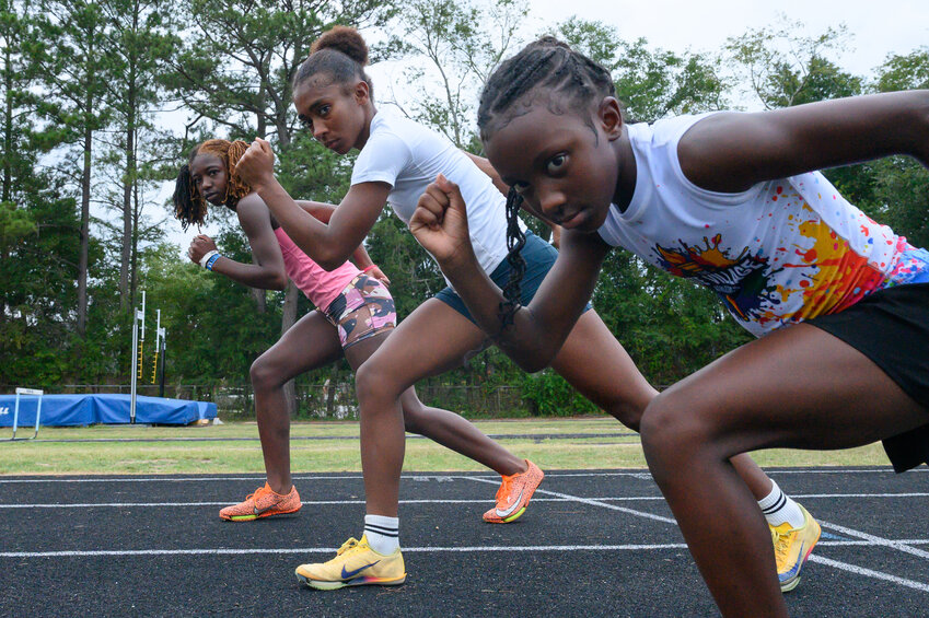Three Sumter track athletes, from left, Malayia English, Taylor Johnson and Jordyn Neal, seen at practice on July 23, will compete in the USATF Junior Olympic Nationals in Norwalk, California, this week.