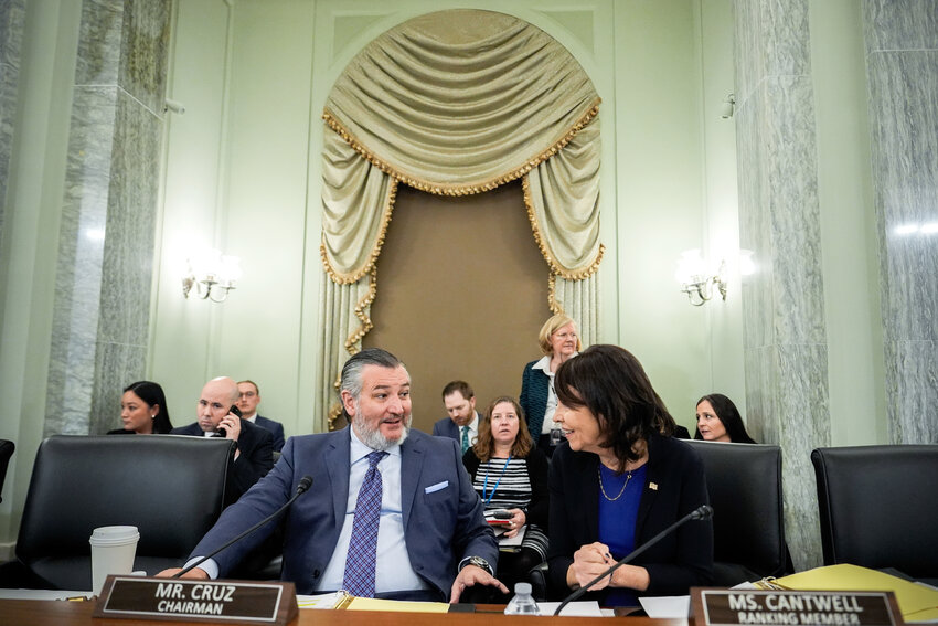 Sen. Ted Cruz, R-Texas, left, chairman of the Senate Commerce, Science and Transportation Committee, speaks with Sen. Maria Cantwell, D-Wash., right, before a hearing on Wednesday, Nov. 19, 2025, on Capitol Hill in Washington.