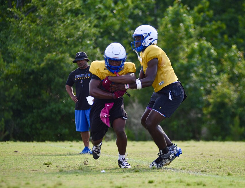 The Sumter High football team runs through drills during spring practice on May 18. They officially kicked off their fall camp on Friday night with a late practice, which began after the deadline for print.