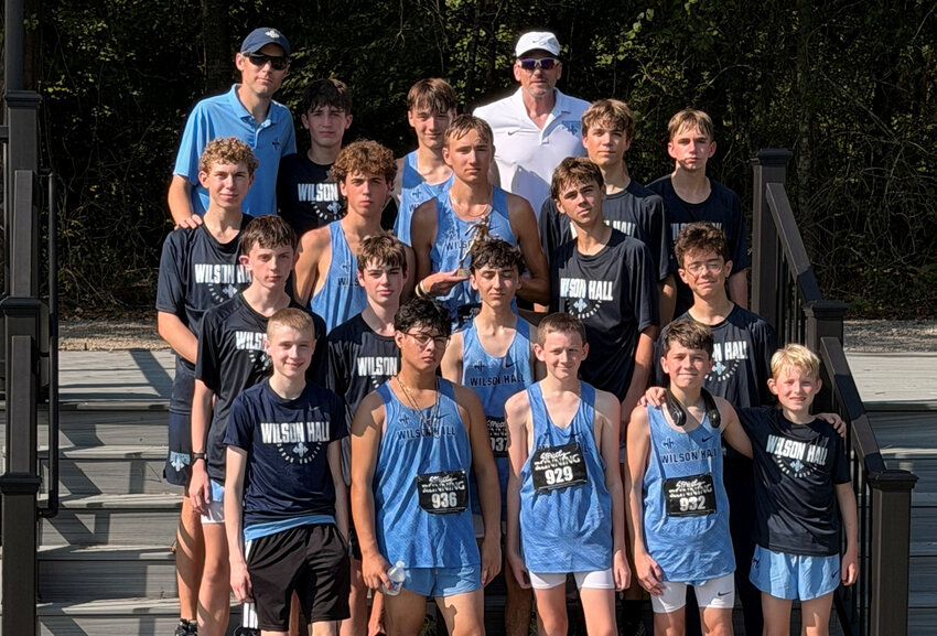 The Wilson Hall boys cross country team poses after winning the Skyhawk Invitational on Saturday, Aug. 15.