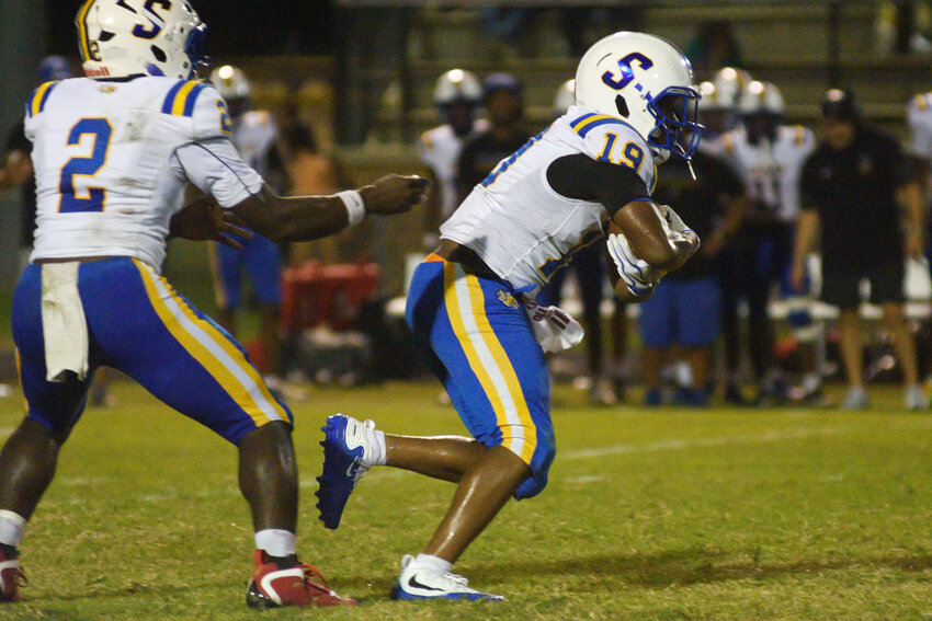 Sumter High's Cleveland Pinkney IV (19) receives a handoff from quarterback Frank Richardson during their matchup with Manning at the FTC Jamboree on Friday, Aug. 14.