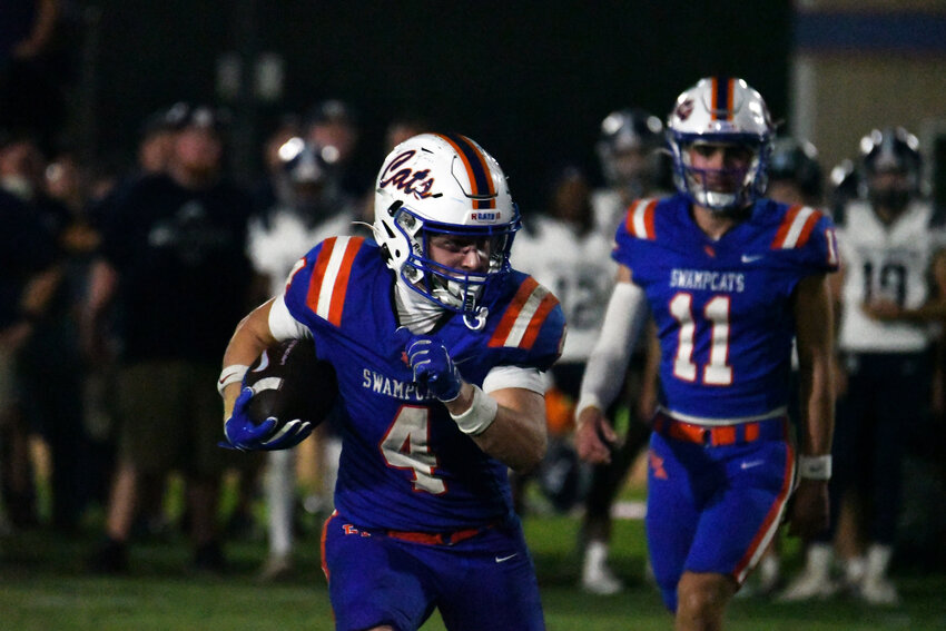 Laurence Manning's Pierson Gamble (4) runs against East Clarendon on Thursday.