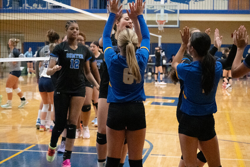 The Sumter High volleyball team celebrates a point against East Clarendon on Thursday.