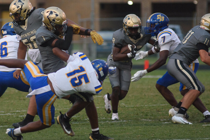 Manning's Destin Thames (8), seen against Scott's Branch, ran for 121 yards and a touchdown in the Monarchs' win over Lake Marion on Friday.