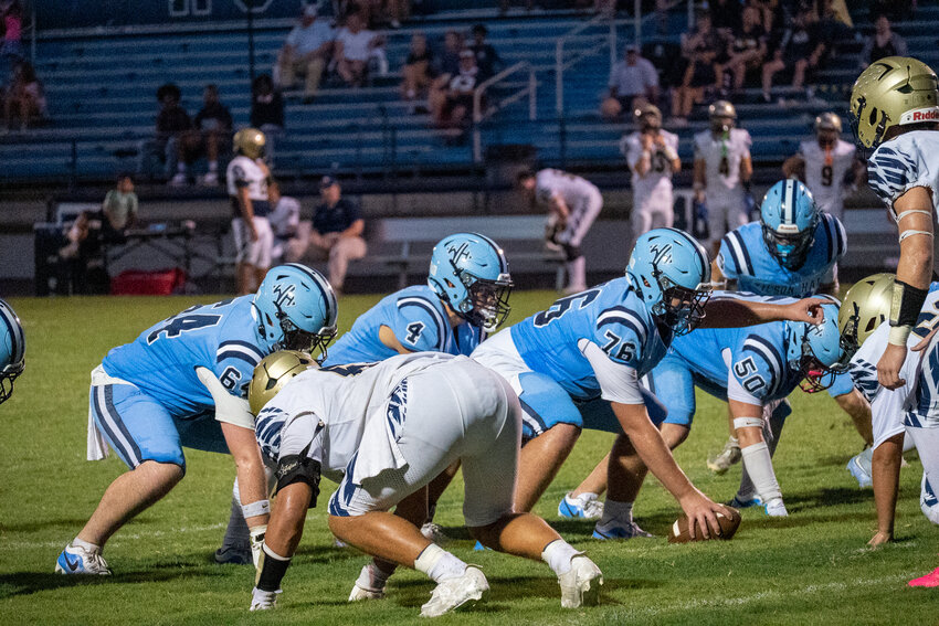 Wilson Hall's Nolan Gooch (4) prepares to take the snap from Wilkes Burnette on Friday against Hilton Head Christian.