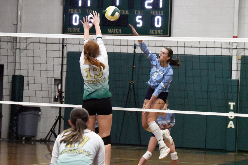 Wilson Hall's McKinley Bath (9) goes up for a kill against Thomas Sumter on Thursday.