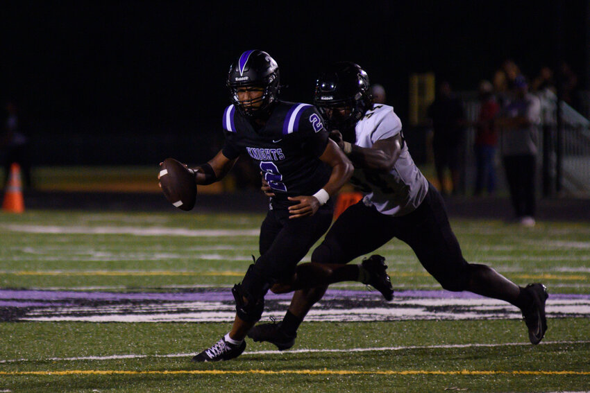 Crestwood quarterback Marek Yates (2) scrambles against Marlboro County on Friday.