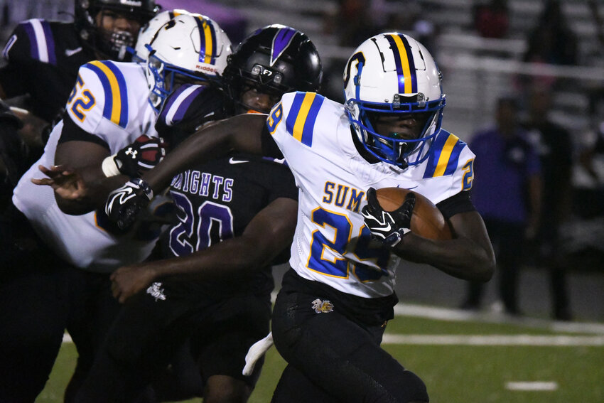 Sumter High's Jamarion Witherspoon (29) carries the ball for the first of his three touchdowns against Crestwood on Friday.