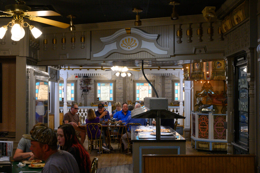 Patrons dine in the main dining room to Pizza Lane recently. New owner Tony Barwick purchased the property last year and has taken steps to return Pizza Lane to its glory days under original owner Billy Lane.