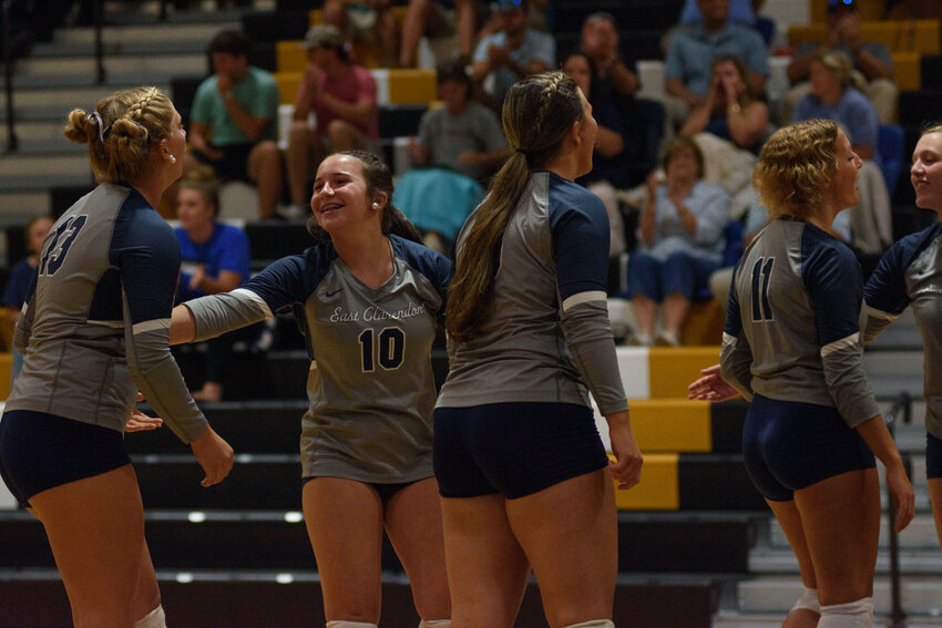 The East Clarendon volleyball team celebrates against Manning on Tuesday.
