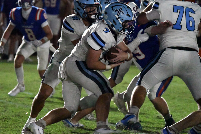 Wilson Hall's Cameron Wilsey (7), seen against Laurence Manning, ran for two touchdowns in the Barons' win over Trinity Collegiate on Friday.