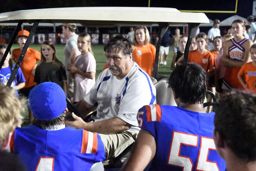Laurence Manning head coach David Rankin addresses his team after a 42-21 win over Wilson Hall on Friday.
