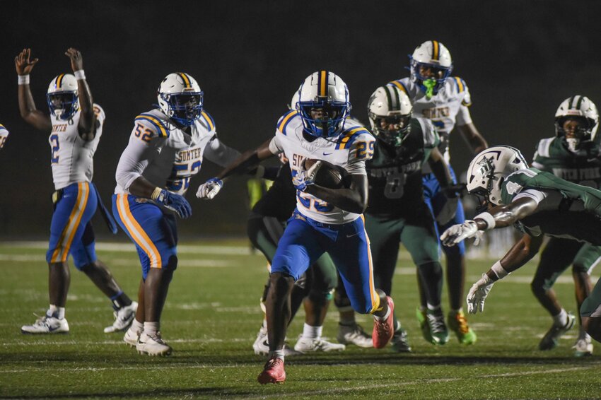 Sumter High's Jamarion Witherspoon (29) scores a touchdown against Dutch Fork on Friday.