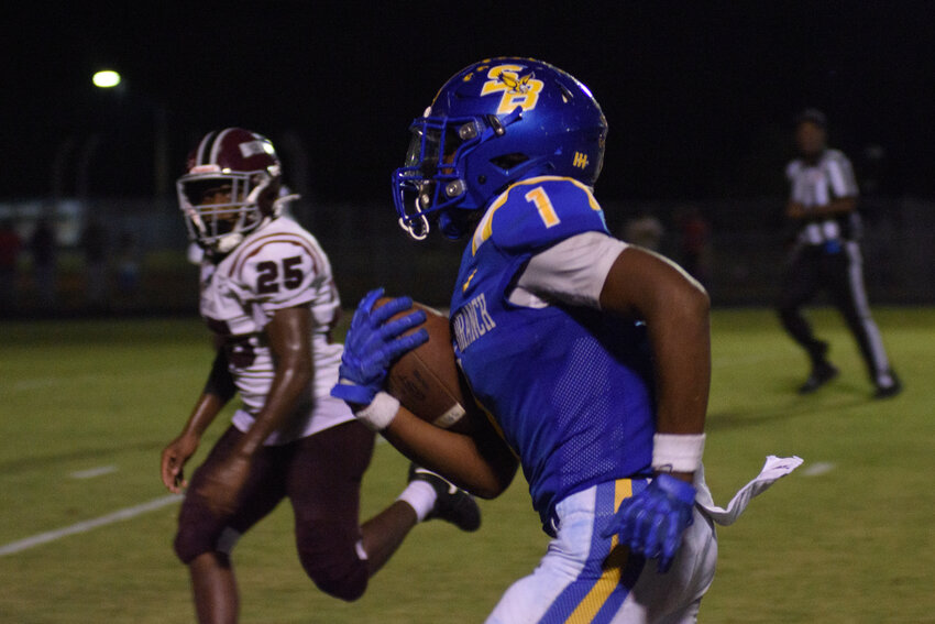 Scott's Branch wide receiver Keith Rogers (1) carries the ball against Baptist Hill on Friday.