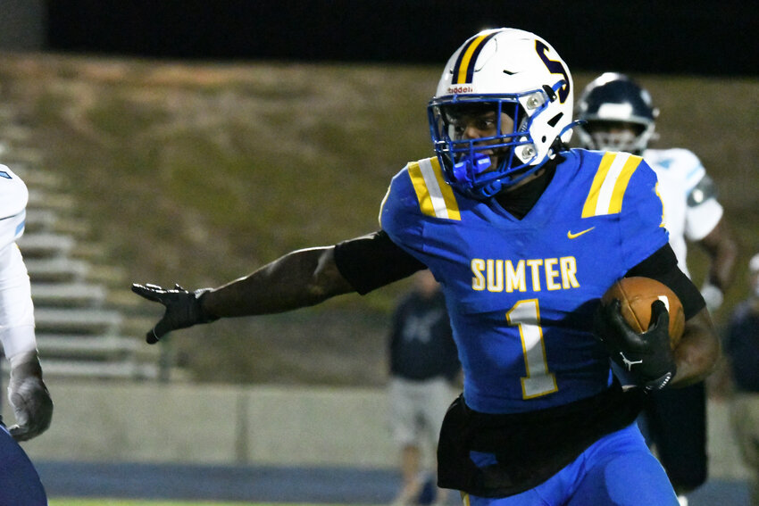 Sumter High's Reggie Shannon carries the ball against Dorman on Friday.
