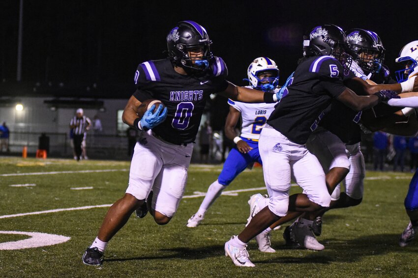Crestwood's CJ Wofford (0) carries the ball against Loris on Friday.