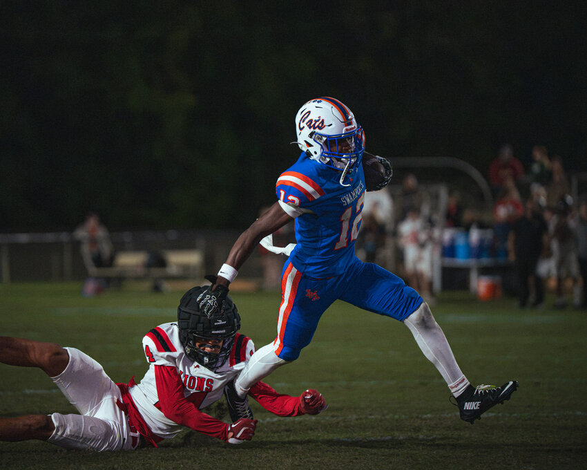 Laurence Manning's AJ Dennis, seen breaking a tackle against Augusta Christian on Sept. 25, returned a punt for a touchdown during the Swampcats' win over Cardinal Newman on Friday.