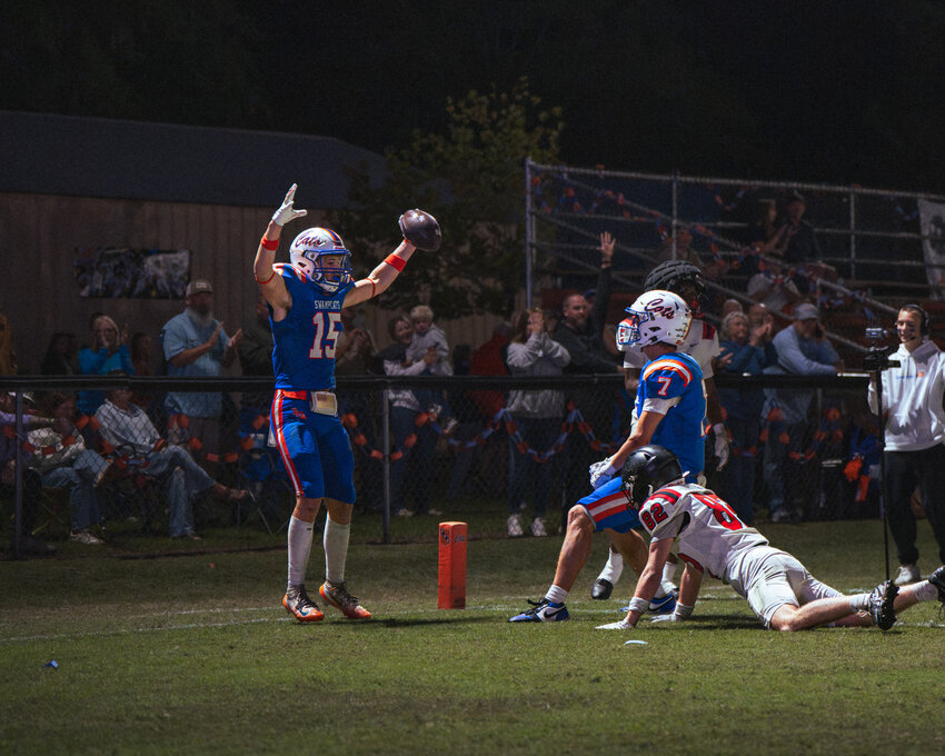Laurence Manning's Asher Sanders (15) celebrates a touchdown against Augusta Christian on Friday.