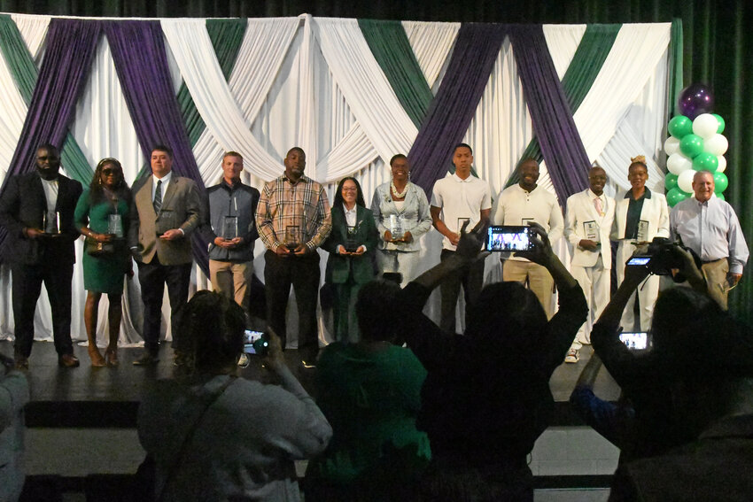 The inaugural class of the Lakewood Athletic Hall of Fame poses for photos after their induction ceremony on Saturday.