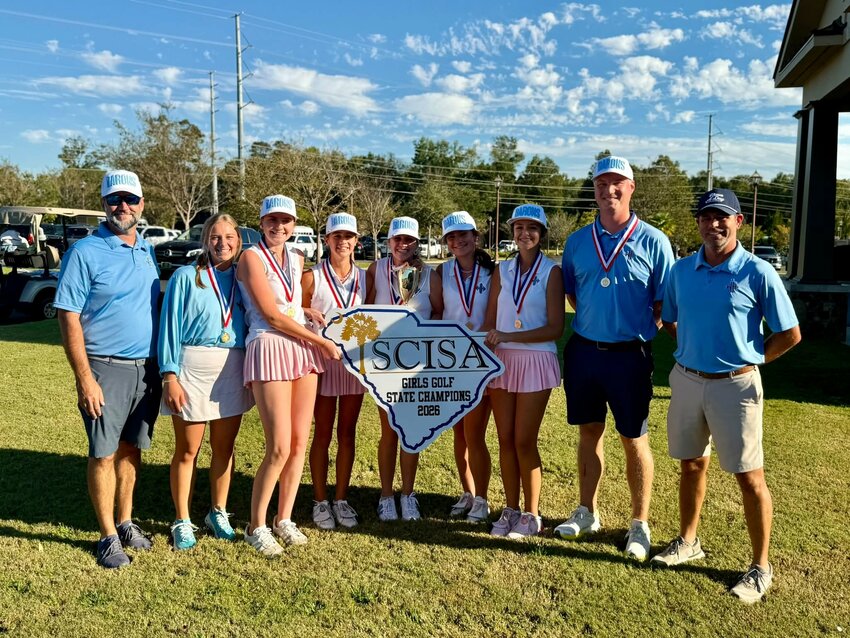 The Wilson Hall golf team poses with their trophy after winning the SCISA state championship for the first time in program history at Orangeburg Country Club on Tuesday.