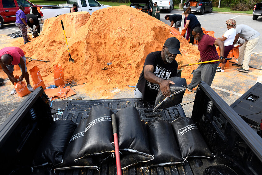 Residents pick up sandbags for storm preparation at the James Seals Jr. Parks &amp; Recreation Center ahead of Hurricane Isaias' expected landfall along the Gulf Coast, on Thursday, Oct. 8, 2026, in Mobile, Alabama.