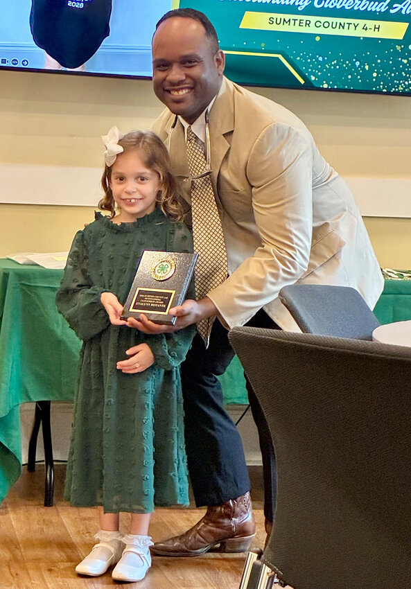 Chris Sumpter presents the Outstanding Cloverbud Award to Evalynn Rotante, age 5.